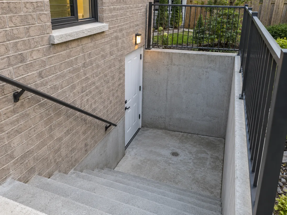 Exterior basement stairwell seen from the upper landing