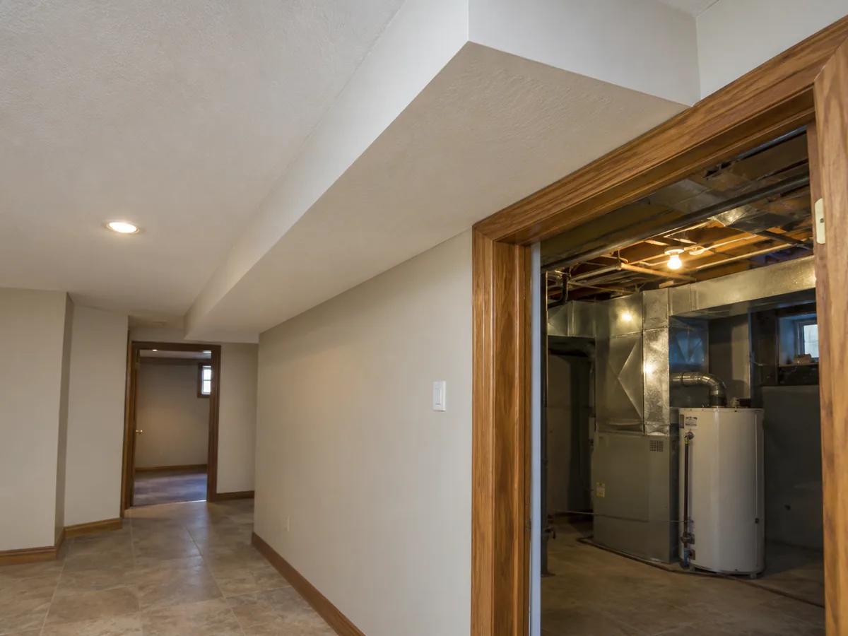 Older finished ceiling bulkhead and accessible utility-room doorway